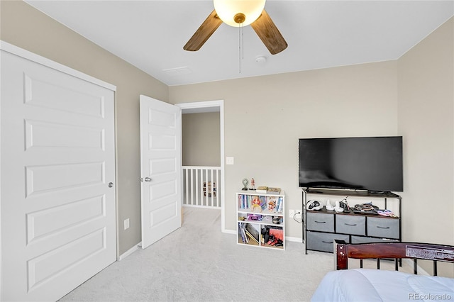 bedroom with carpet floors, baseboards, and a ceiling fan