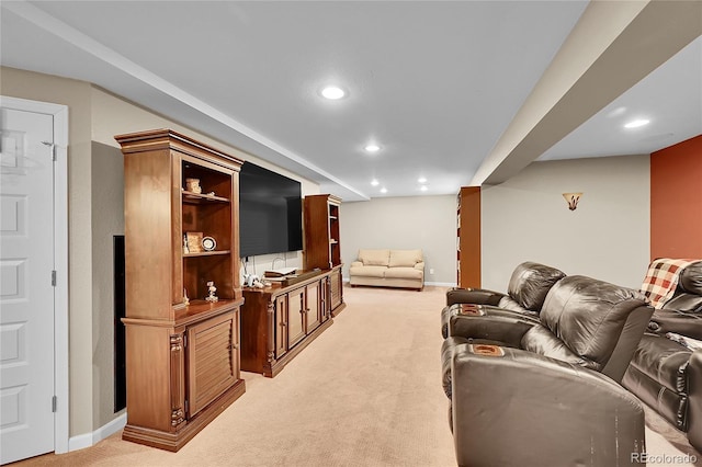 living room featuring light colored carpet, recessed lighting, and baseboards