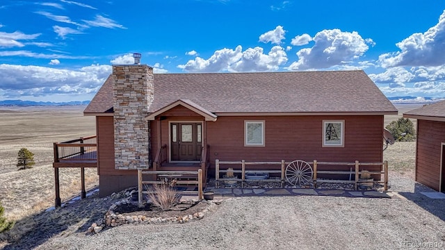 7103 Ranch Rd, Hartsel, CO 80449 - rustic home featuring roof with shingles and a chimney