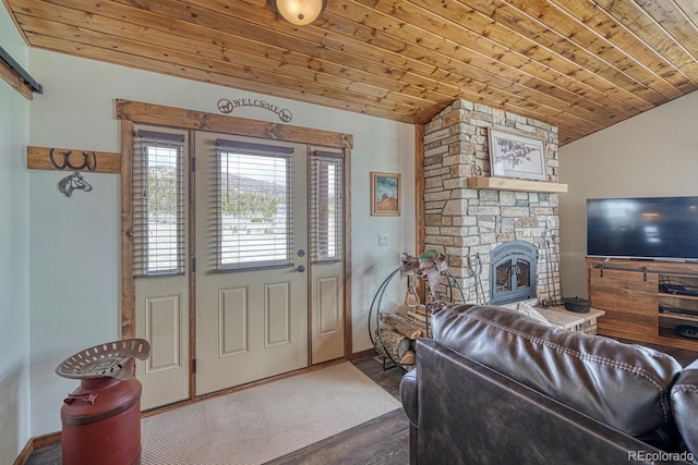 7103 Ranch Rd, Hartsel, CO 80449 - living room featuring wood ceiling, vaulted ceiling, a stone fireplace, wood finished floors, and baseboards