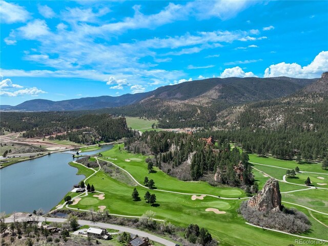 bird's eye view of a water and mountain view and a golf club