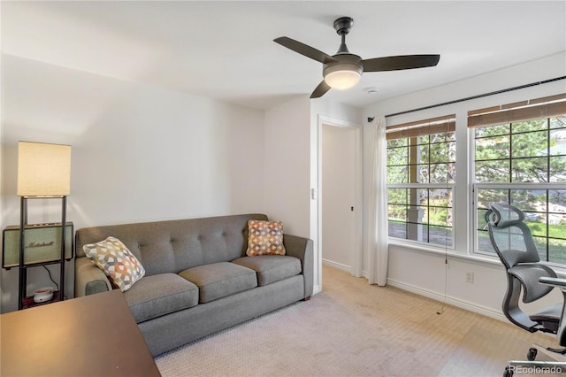 home office with plenty of natural light, ceiling fan, and baseboards