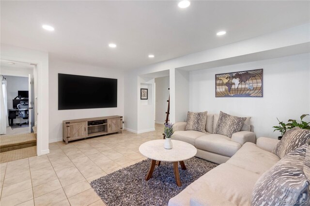 living area with recessed lighting, light tile patterned floors, and baseboards