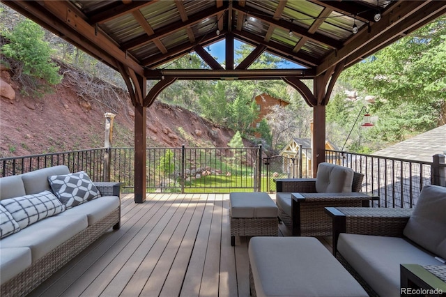 deck featuring outdoor lounge area and a gazebo