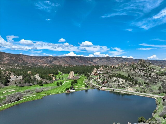 drone / aerial view of a water and mountain view