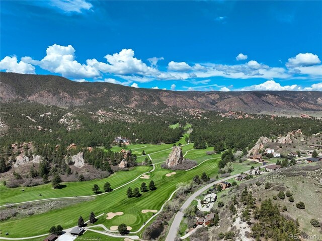 view of mountain backdrop featuring a golf course