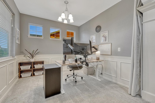 22583 E Union Cir, Aurora, CO 80015 - home office with a decorative wall, a wainscoted wall, a chandelier, and carpet