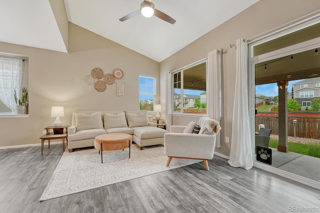 22583 E Union Cir, Aurora, CO 80015 - living room featuring wood finished floors, a ceiling fan, and vaulted ceiling