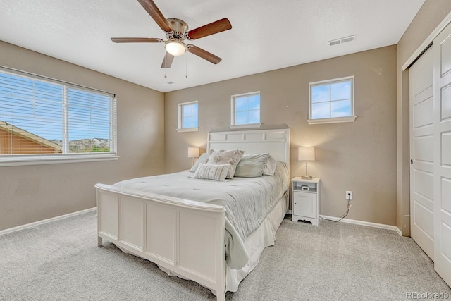 22583 E Union Cir, Aurora, CO 80015 - bedroom with light carpet and ceiling fan