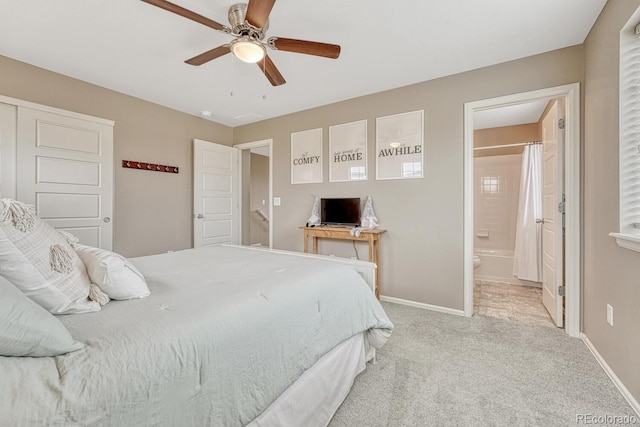 22583 E Union Cir, Aurora, CO 80015 - bedroom featuring light colored carpet, ensuite bath, and a ceiling fan