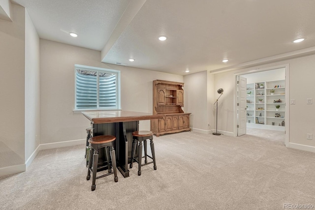 22583 E Union Cir, Aurora, CO 80015 - dining space featuring light colored carpet, recessed lighting, and bar area