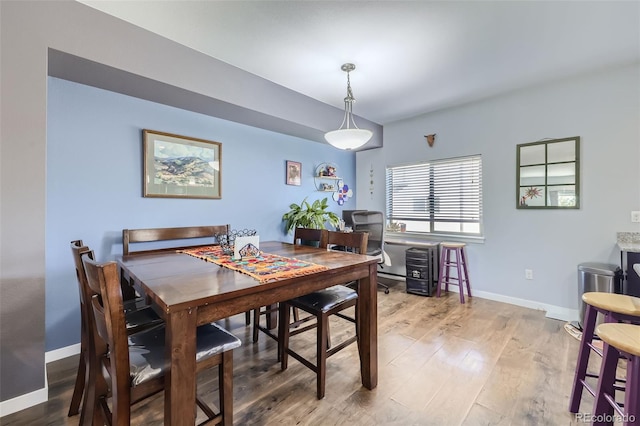 dining space featuring hardwood / wood-style floors