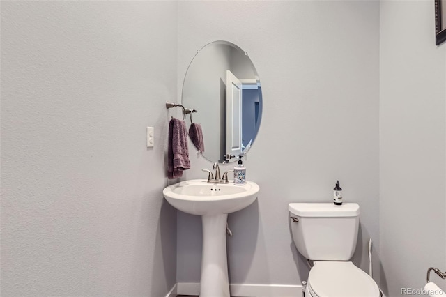 bathroom featuring toilet