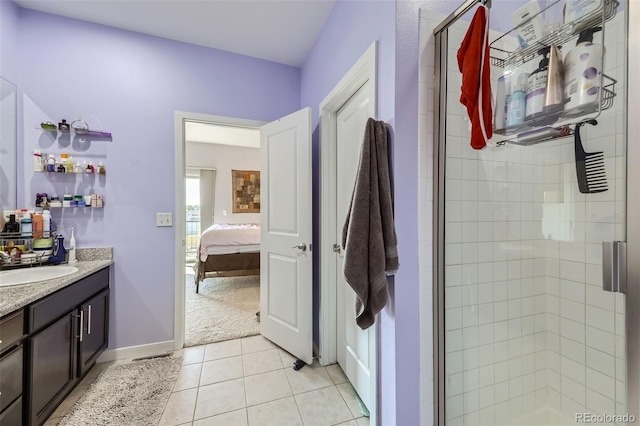 bathroom featuring vanity, tile patterned flooring, and an enclosed shower