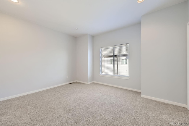 unfurnished room featuring carpet flooring