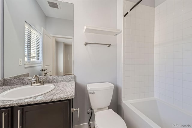 full bathroom with vanity, toilet, and tiled shower / bath combo