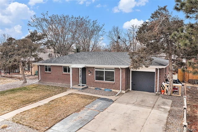 single story home with an attached garage, brick siding, driveway, and a shingled roof