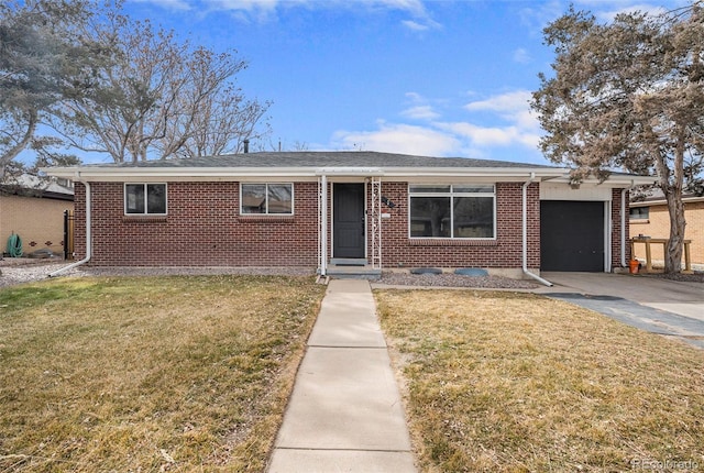 ranch-style home with a front lawn, brick siding, a garage, and driveway