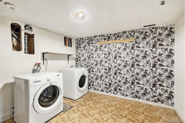 washroom featuring laundry area, independent washer and dryer, and light floors