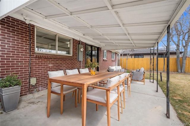 view of patio / terrace with outdoor dining area and fence