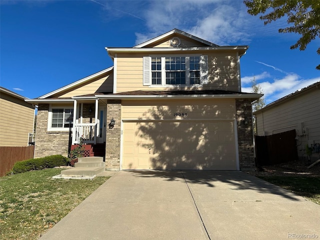 view of front facade with a front lawn and a garage