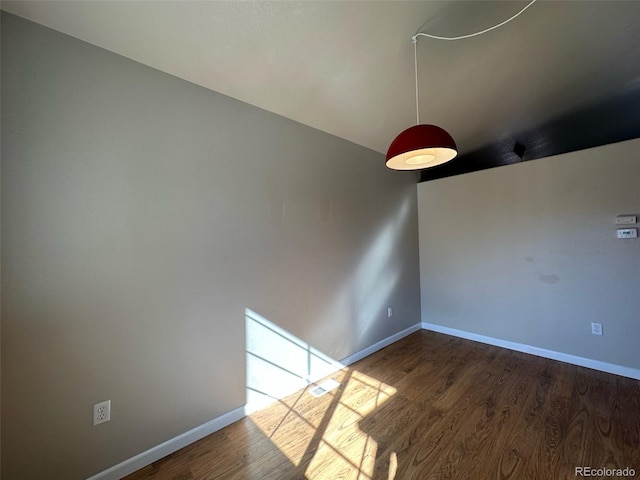 spare room featuring dark hardwood / wood-style floors