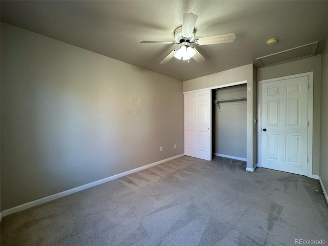 unfurnished bedroom featuring ceiling fan, a closet, and dark colored carpet