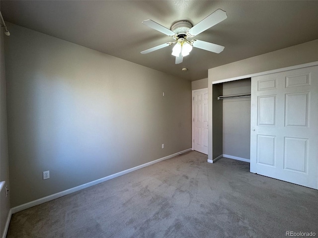 unfurnished bedroom with a closet, light carpet, and ceiling fan