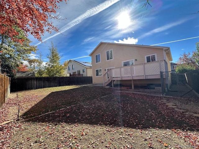 rear view of property with a deck