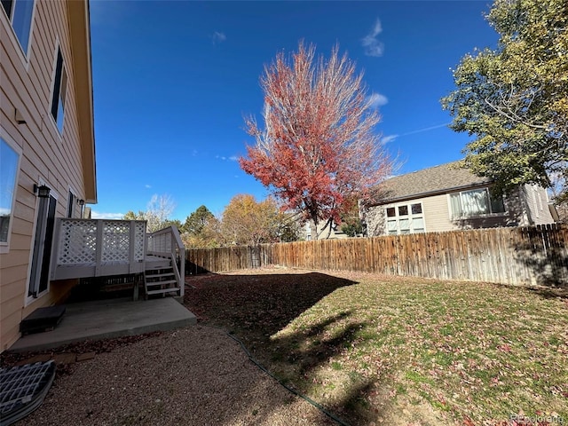 view of yard featuring a wooden deck