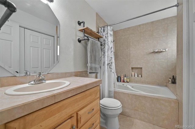 full bath with tile patterned floors, tiled shower / bath combo, toilet, and vanity