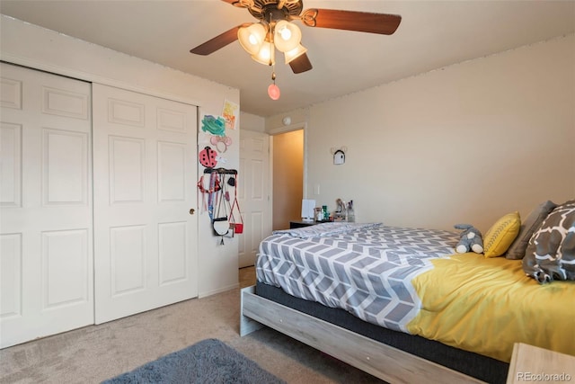bedroom featuring carpet flooring, a closet, and a ceiling fan