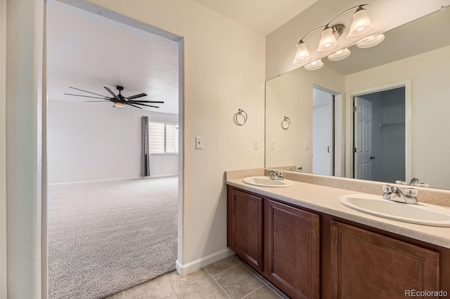 bathroom with tile patterned floors, ceiling fan, and vanity