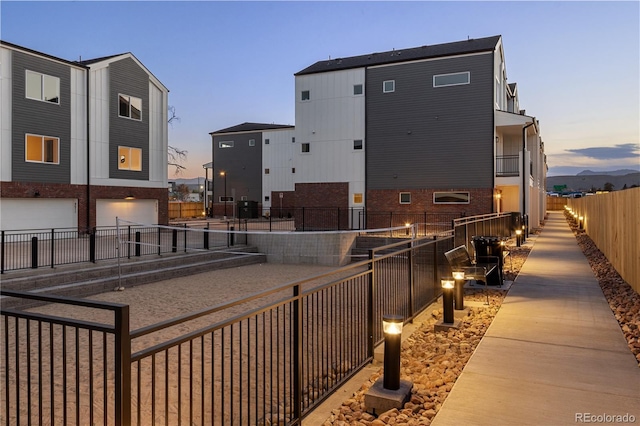 exterior space with a garage and fence