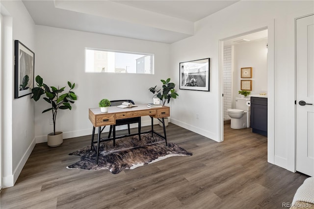 office space with wood finished floors and baseboards