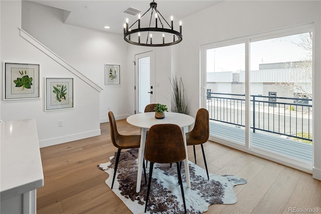 dining space with visible vents, baseboards, a notable chandelier, light wood-type flooring, and recessed lighting