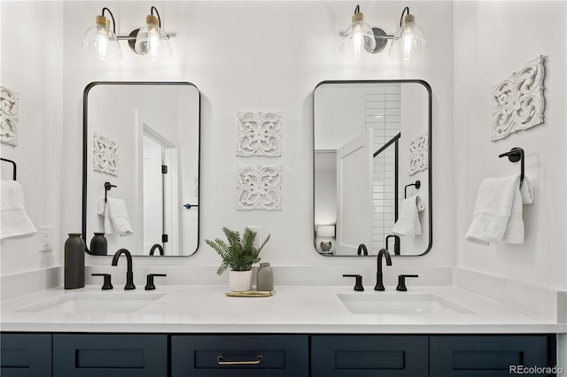 bathroom featuring double vanity and a sink