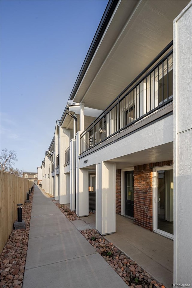 view of community featuring a patio area and fence