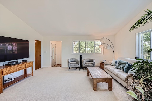 living room with lofted ceiling and light carpet