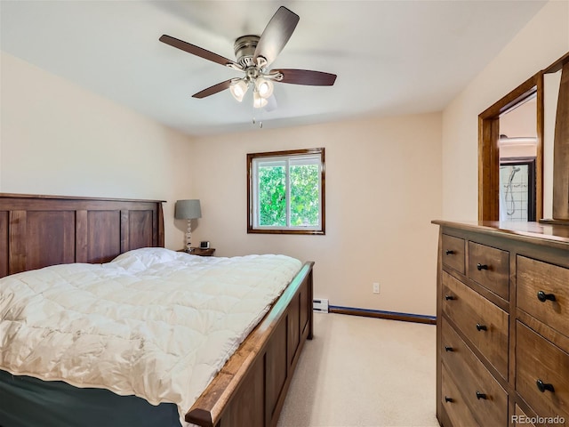 carpeted bedroom with ceiling fan and a baseboard radiator