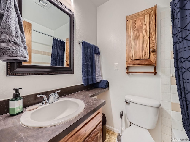 bathroom featuring walk in shower, vanity, and toilet