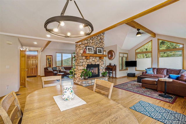 31755 Ponderosa Way, Evergreen, CO 80439 - dining space featuring healthy amount of natural light, wood finished floors, a fireplace, and recessed lighting