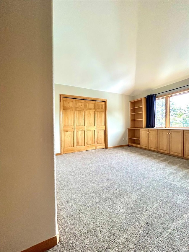 31755 Ponderosa Way, Evergreen, CO 80439 - unfurnished room with light colored carpet and vaulted ceiling