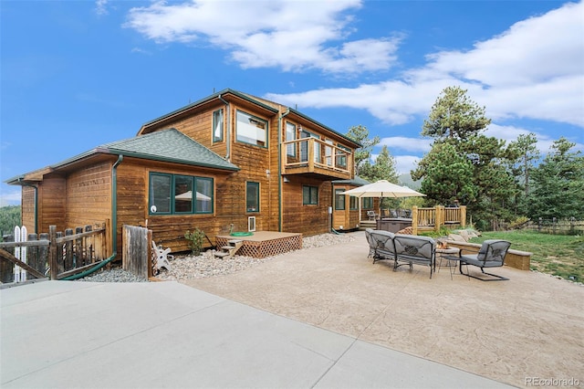 31755 Ponderosa Way, Evergreen, CO 80439 - rear view of house with a patio area, a balcony, and roof with shingles