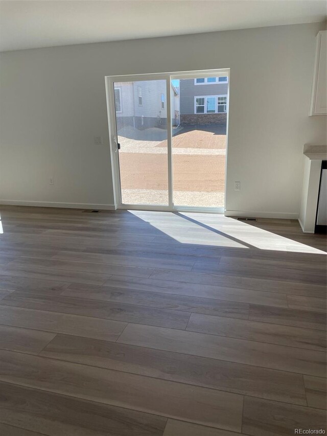 21996 E 39th Pl, Aurora, CO 80019 - unfurnished dining area with dark wood finished floors and baseboards