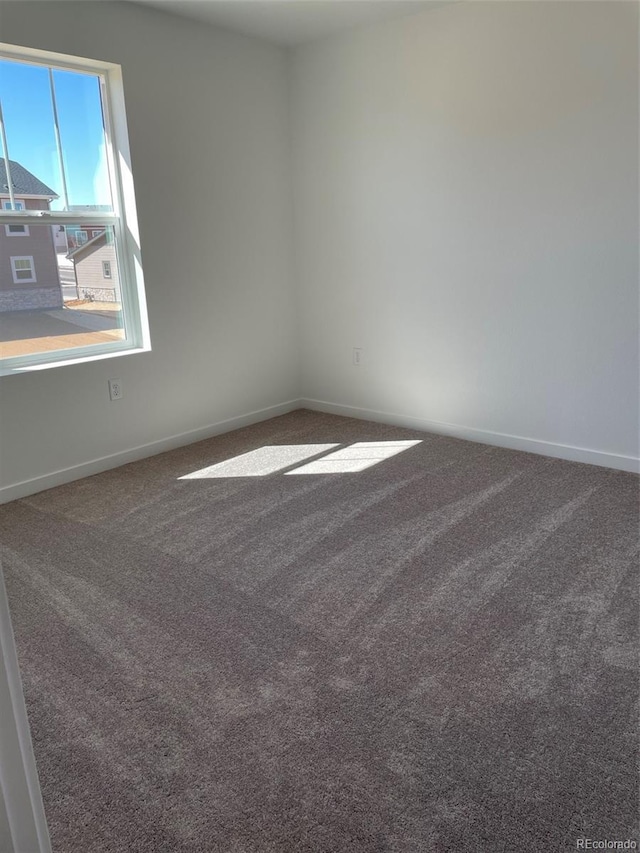 21996 E 39th Pl, Aurora, CO 80019 - carpeted spare room with baseboards