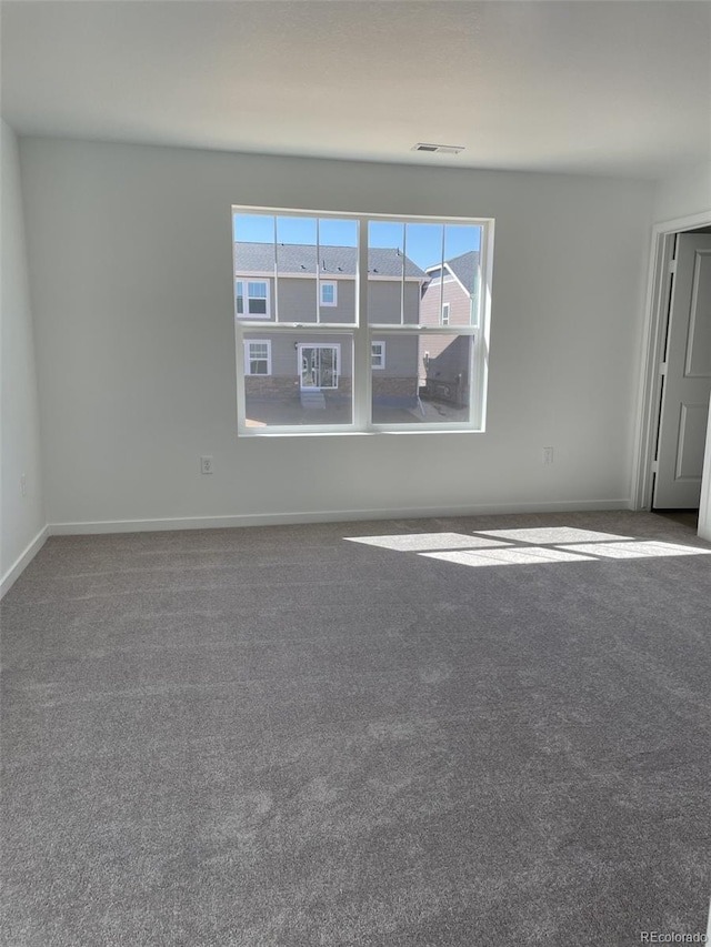 21996 E 39th Pl, Aurora, CO 80019 - carpeted empty room with baseboards
