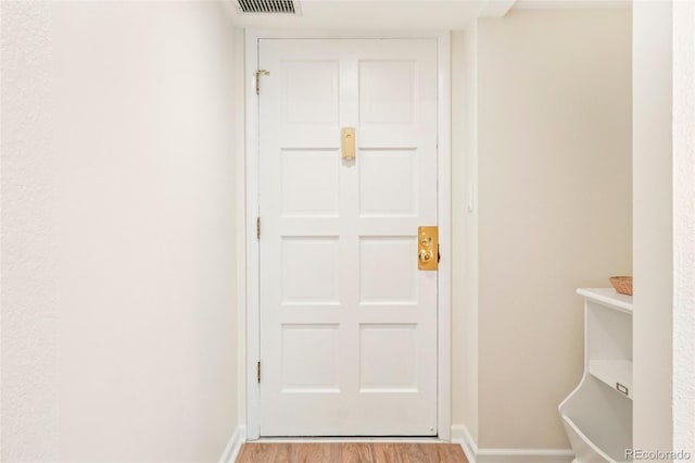 7305 S Xenia Cir Unit E, Centennial, CO 80112 - doorway with wood finished floors and baseboards