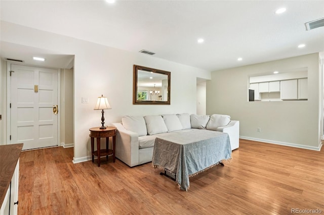7305 S Xenia Cir Unit E, Centennial, CO 80112 - living room with light wood finished floors and recessed lighting