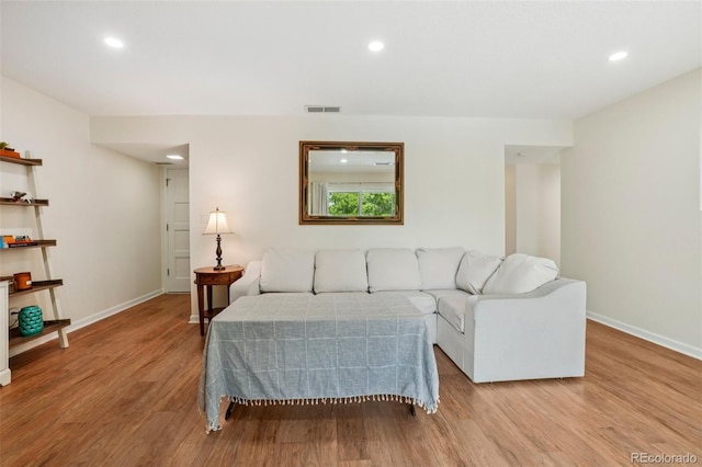 7305 S Xenia Cir Unit E, Centennial, CO 80112 - living area featuring wood finished floors and recessed lighting